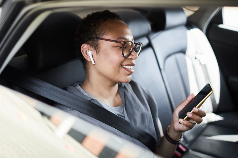 Business traveler in a luxury car